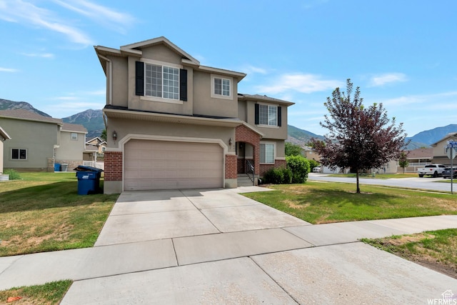 901 S Apple Grove Ln, Pleasant Grove, UT 84062 - traditional-style house with a mountain view, a garage, driveway, brick siding, and a front lawn