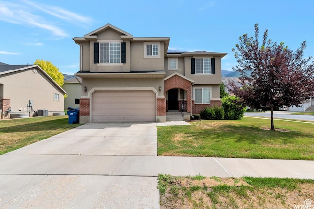 901 S Apple Grove Ln, Pleasant Grove, UT 84062 - traditional-style house featuring stucco siding, solar panels, concrete driveway, and a front yard