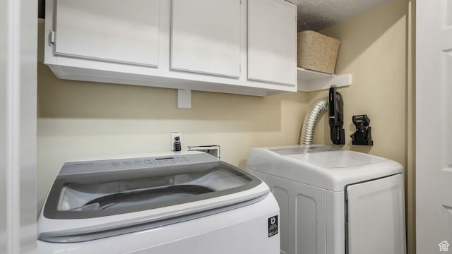 3737 S Washington Dr W, Magna, UT 84044 - laundry room featuring washer and dryer and cabinet space