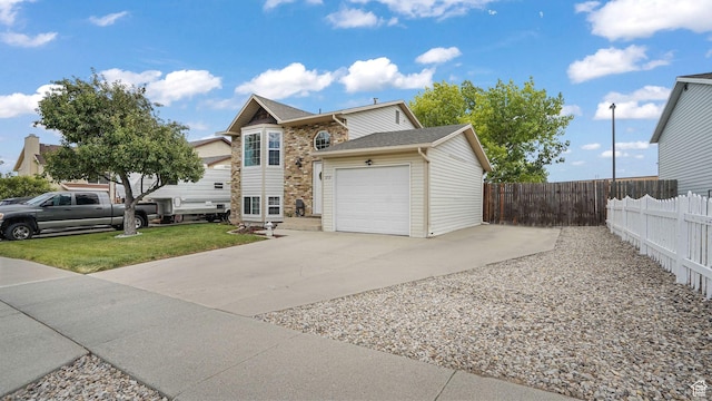 3737 S Washington Dr W, Magna, UT 84044 - view of front of house with concrete driveway, a garage, brick siding, and a shingled roof