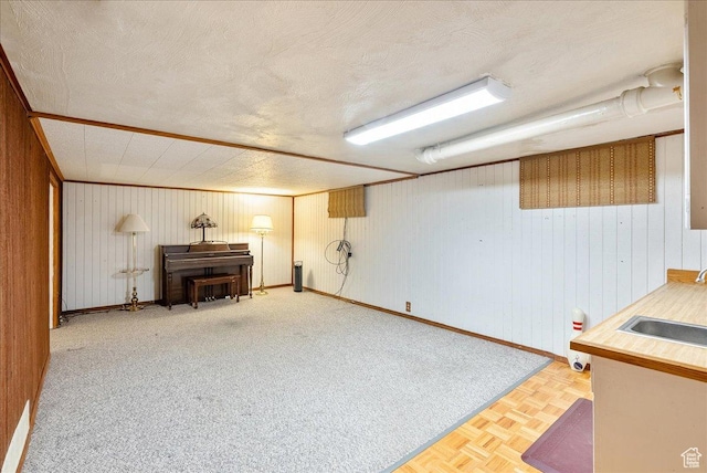 458 E 8800 S, Sandy, UT 84070 - finished basement featuring wood walls, a textured ceiling, and a wood stove