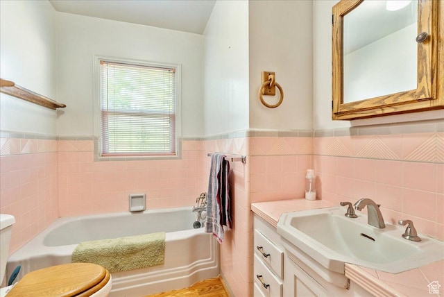 458 E 8800 S, Sandy, UT 84070 - full bathroom with a garden tub, tile walls, vanity, and a wainscoted wall