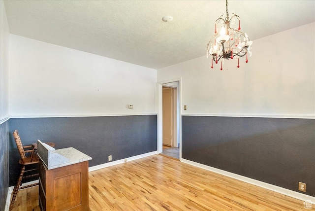 458 E 8800 S, Sandy, UT 84070 - unfurnished dining area with wood finished floors and a chandelier