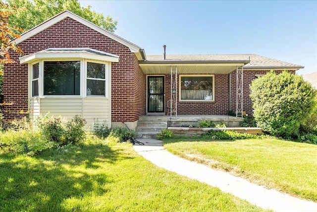458 E 8800 S, Sandy, UT 84070 - view of front of house with brick siding, a front yard, and covered porch