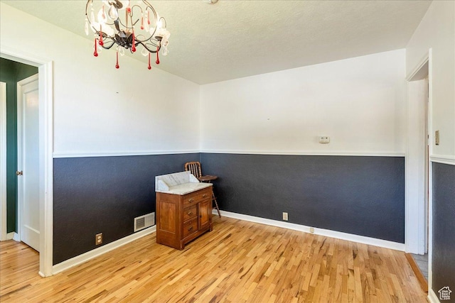 458 E 8800 S, Sandy, UT 84070 - unfurnished room featuring a chandelier and light wood-style flooring