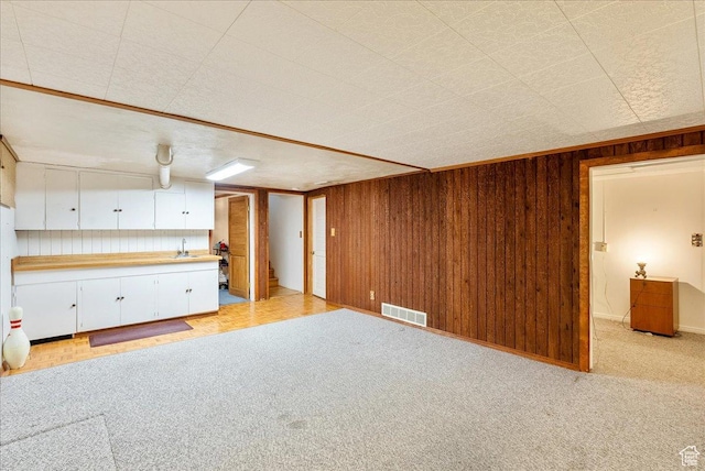 458 E 8800 S, Sandy, UT 84070 - unfurnished living room with light carpet and wooden walls