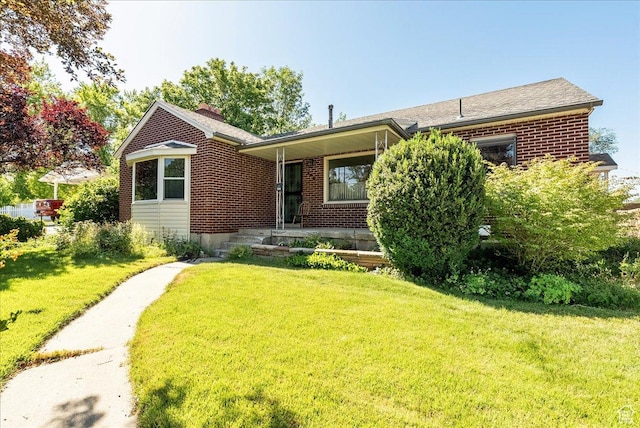 458 E 8800 S, Sandy, UT 84070 - ranch-style home with brick siding, a front yard, a porch, and a chimney
