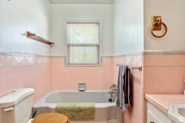 458 E 8800 S, Sandy, UT 84070 - bathroom featuring tile walls, a garden tub, a wainscoted wall, and vanity