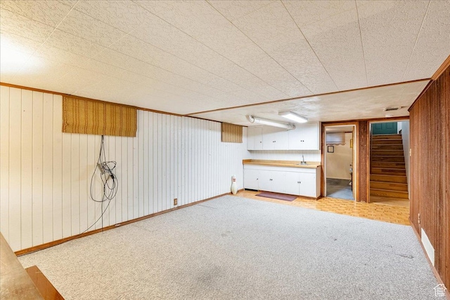 458 E 8800 S, Sandy, UT 84070 - finished below grade area with light carpet, stairs, and wood walls