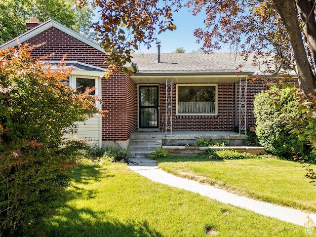 458 E 8800 S, Sandy, UT 84070 - view of front of property featuring brick siding, a chimney, and a front lawn