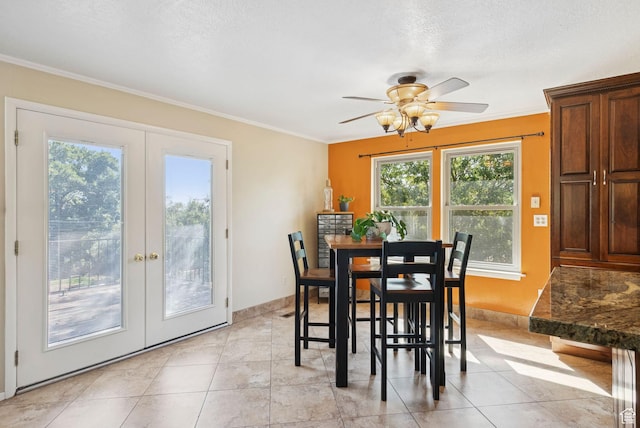 2999 N 300 E, North Ogden, UT 84414 - dining area featuring french doors, crown molding, a ceiling fan, a textured ceiling, and light tile patterned floors