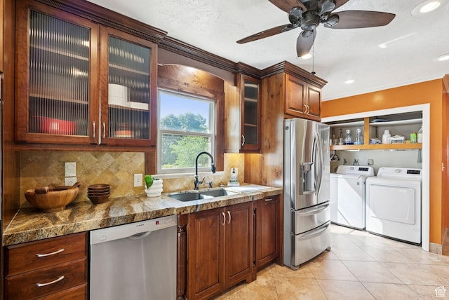 2999 N 300 E, North Ogden, UT 84414 - kitchen featuring appliances with stainless steel finishes, washer and clothes dryer, backsplash, glass insert cabinets, and recessed lighting