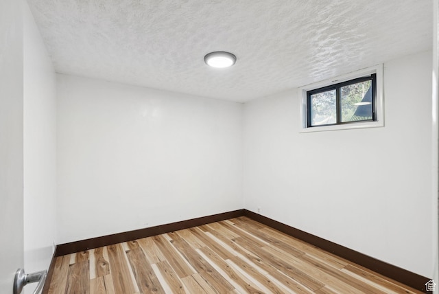 2999 N 300 E, North Ogden, UT 84414 - unfurnished room with a textured ceiling and wood finished floors