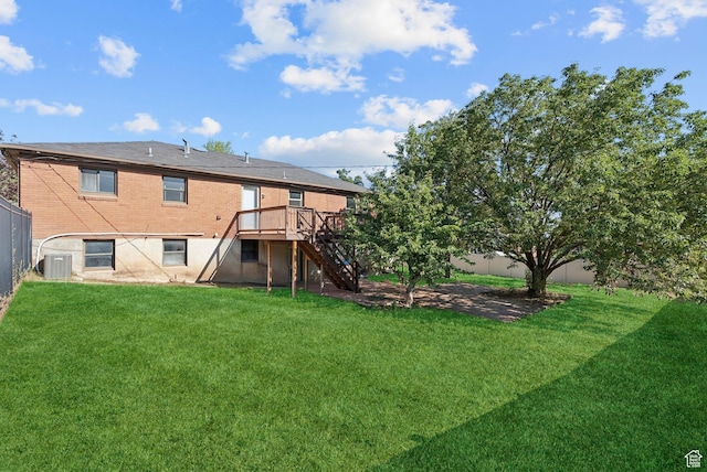 2999 N 300 E, North Ogden, UT 84414 - back of house with stairway, a fenced backyard, a deck, and brick siding
