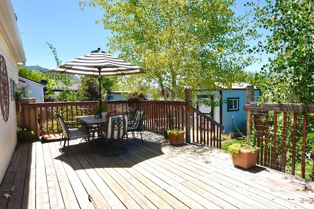 856 S 860 W, Tooele, UT 84074 - wooden deck featuring outdoor dining area