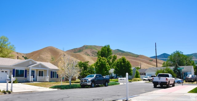 856 S 860 W, Tooele, UT 84074 - view of asphalt road featuring a mountain view, sidewalks, and curbs