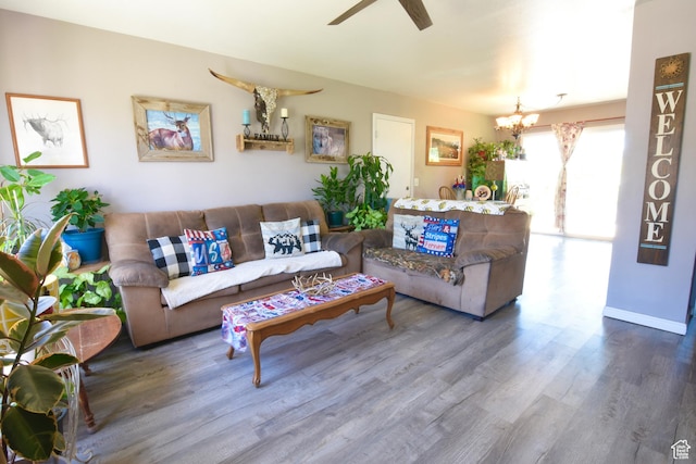 856 S 860 W, Tooele, UT 84074 - living area featuring wood finished floors, a chandelier, and ceiling fan