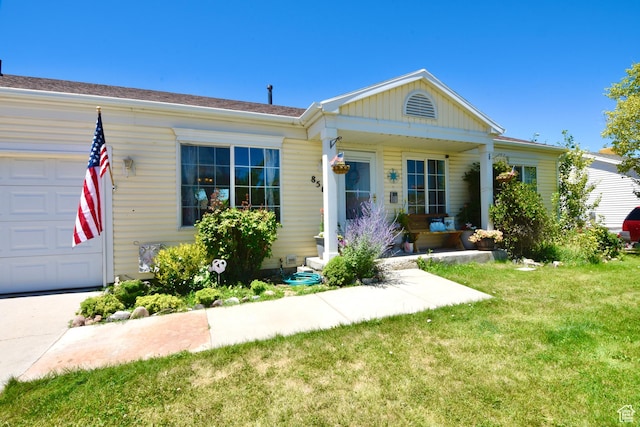 856 S 860 W, Tooele, UT 84074 - view of front of property with a front yard, a garage, a porch, and board and batten siding