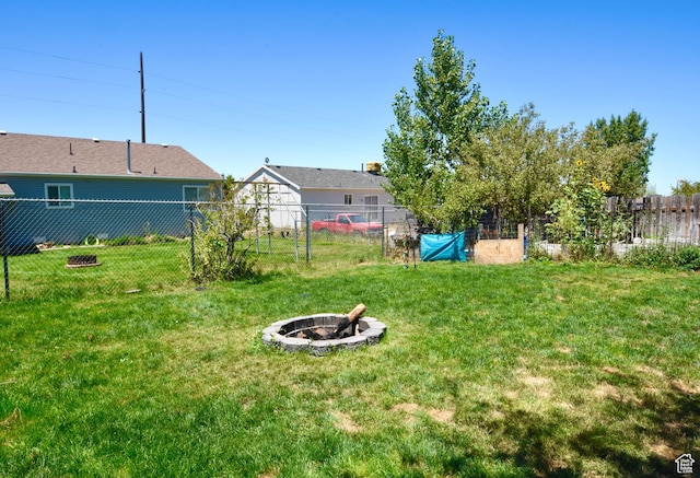856 S 860 W, Tooele, UT 84074 - fenced backyard with an outdoor fire pit