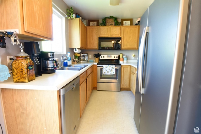 856 S 860 W, Tooele, UT 84074 - kitchen with appliances with stainless steel finishes, light floors, and light countertops