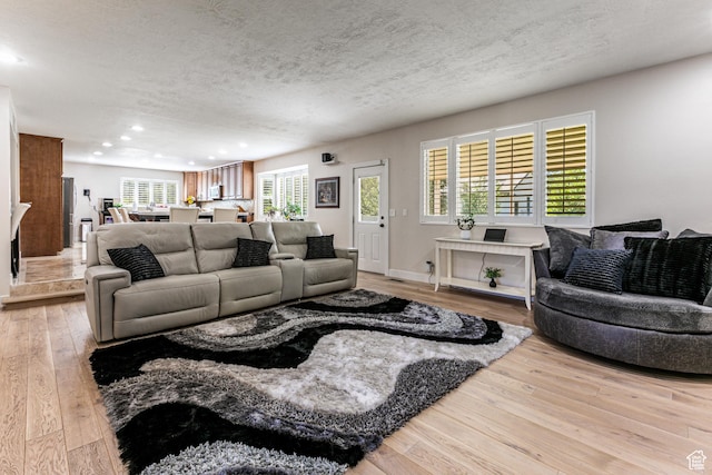 2148 E Pinecrest Ln S, Sandy, UT 84092 - living room with light wood finished floors, recessed lighting, and a textured ceiling