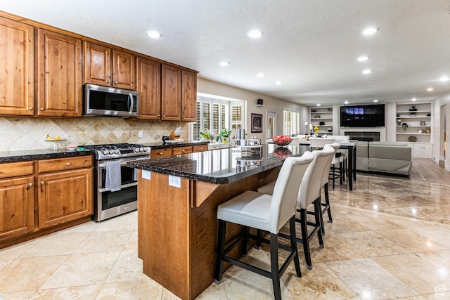 2148 E Pinecrest Ln S, Sandy, UT 84092 - kitchen featuring stainless steel appliances, recessed lighting, tasteful backsplash, a center island, and brown cabinetry