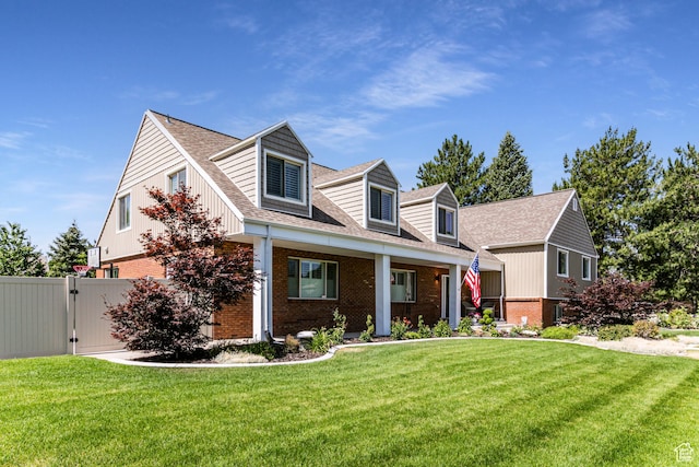 2148 E Pinecrest Ln S, Sandy, UT 84092 - cape cod-style house with brick siding, a gate, and a shingled roof