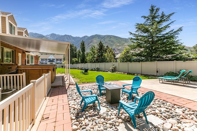 2148 E Pinecrest Ln S, Sandy, UT 84092 - fenced backyard with an outdoor fire pit, a patio, and a mountain view