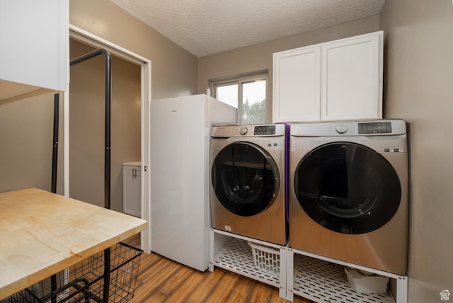 3378 N Sr 87 W, Talmage, UT 84073 - laundry room featuring washing machine and clothes dryer, cabinet space, wood finished floors, and a textured ceiling