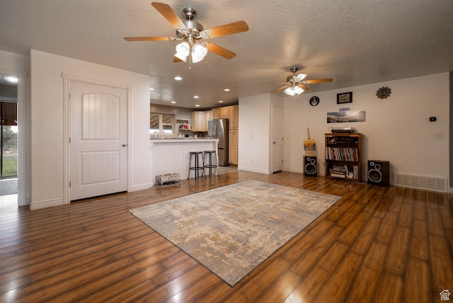 3378 N Sr 87 W, Talmage, UT 84073 - living area with a ceiling fan, wood finished floors, a textured ceiling, and recessed lighting