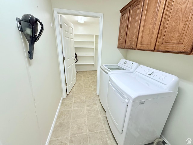 2205 N 600 E, North Ogden, UT 84414 - laundry room featuring washing machine and dryer, cabinet space, and light tile patterned floors
