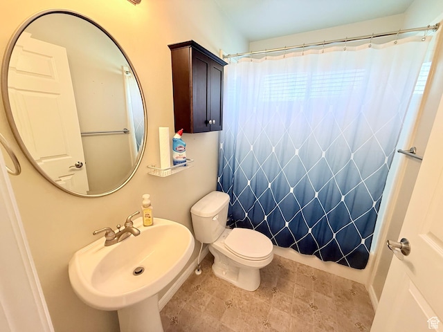 2205 N 600 E, North Ogden, UT 84414 - bathroom featuring a shower with curtain and stone finish floors