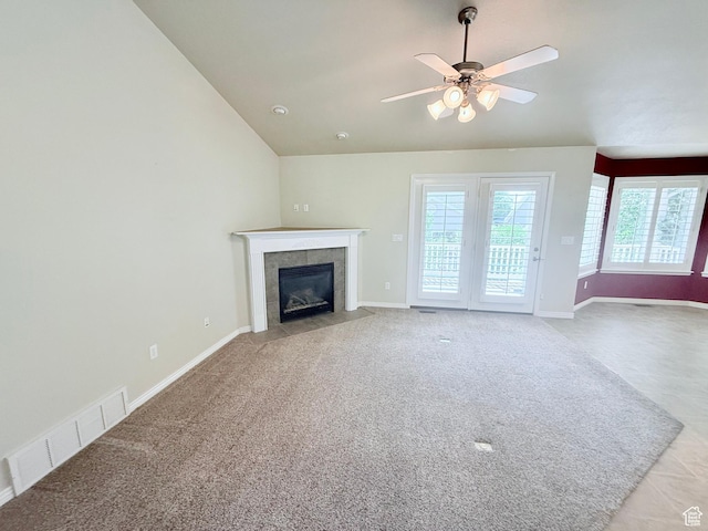 2205 N 600 E, North Ogden, UT 84414 - unfurnished living room with carpet flooring, a tile fireplace, lofted ceiling, and ceiling fan