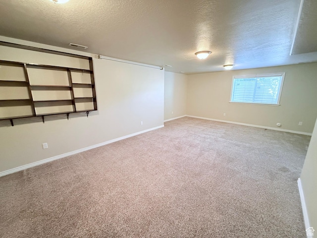 2205 N 600 E, North Ogden, UT 84414 - spare room with a textured ceiling and carpet flooring