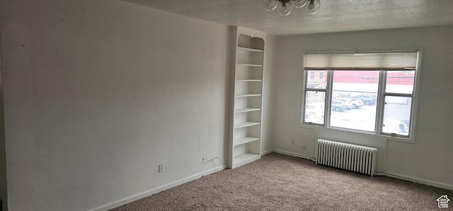40 W 400 N Unit 1-6, Spanish Fork, UT 84660 - unfurnished room with radiator heating unit, carpet floors, a textured ceiling, and a chandelier