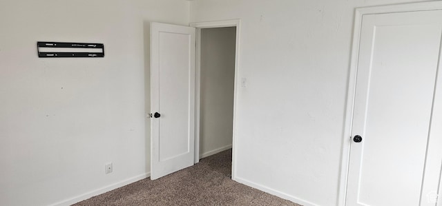 40 W 400 N Unit 1-6, Spanish Fork, UT 84660 - unfurnished bedroom with dark colored carpet and baseboards