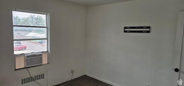 40 W 400 N Unit 1-6, Spanish Fork, UT 84660 - spare room featuring radiator heating unit, dark carpet, and cooling unit