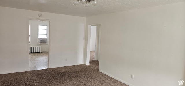 40 W 400 N Unit 1-6, Spanish Fork, UT 84660 - carpeted spare room featuring radiator heating unit, a textured ceiling, and cooling unit