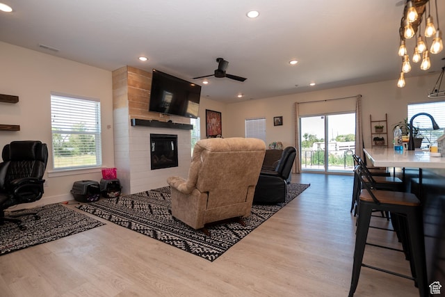 365 N 800 E, Beaver, UT 84713 - living room featuring wood finished floors, a fireplace, recessed lighting, and a ceiling fan