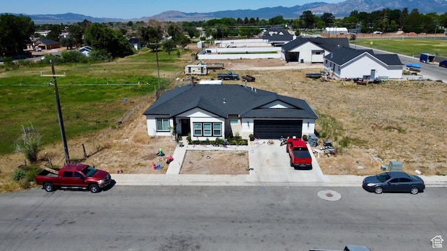 365 N 800 E, Beaver, UT 84713 - view of front of house with a mountain view, a garage, and concrete driveway
