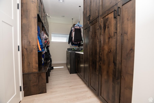 365 N 800 E, Beaver, UT 84713 - laundry room featuring washer and dryer, light wood finished floors, and cabinet space