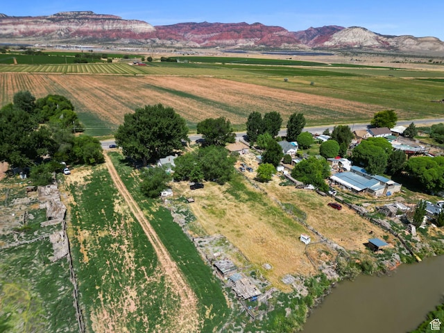 180 N State St, Sigurd, UT 84657 - aerial view of property and surrounding area with rural landscape, large plots for crops, and mountains