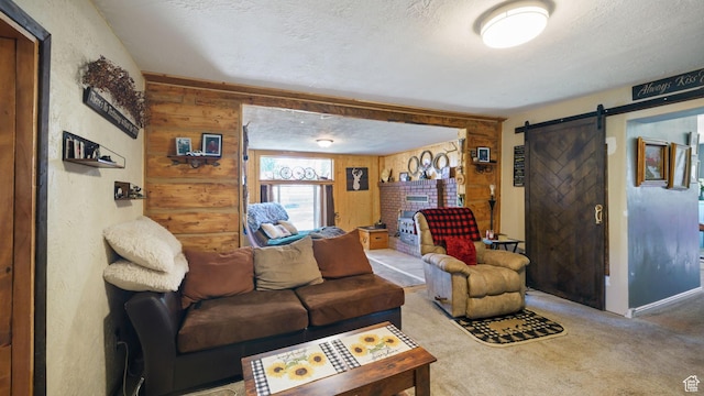 180 N State St, Sigurd, UT 84657 - carpeted living room featuring a barn door, a textured ceiling, and wooden walls