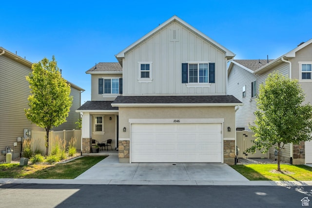 1046 W Stonehaven Dr, North Salt Lake, UT 84054 - traditional-style home featuring stone siding, board and batten siding, concrete driveway, and an attached garage
