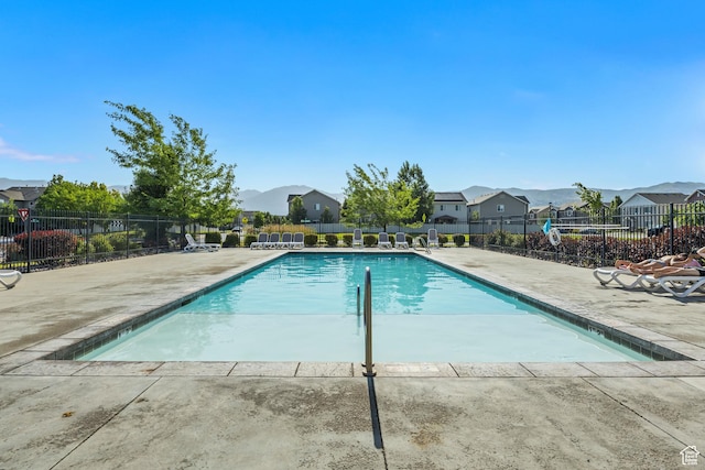 1046 W Stonehaven Dr, North Salt Lake, UT 84054 - community pool with a patio, a residential view, and a mountain view