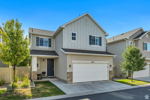 1046 W Stonehaven Dr, North Salt Lake, UT 84054 - view of front facade with stone siding, board and batten siding, an attached garage, driveway, and roof with shingles