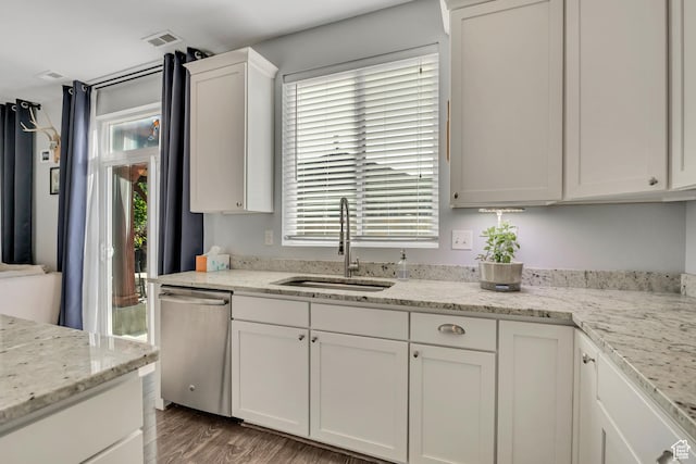 1046 W Stonehaven Dr, North Salt Lake, UT 84054 - kitchen with dishwasher, white cabinets, wood finished floors, and light stone counters