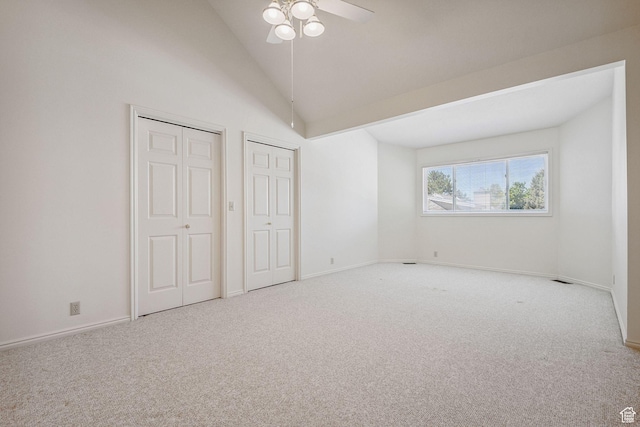 2056 E Sierra View Cir, Millcreek, UT 84109 - unfurnished bedroom featuring multiple closets, carpet flooring, vaulted ceiling, and a ceiling fan