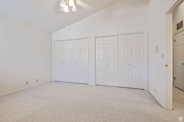 2056 E Sierra View Cir, Millcreek, UT 84109 - unfurnished bedroom with vaulted ceiling, light colored carpet, two closets, and ceiling fan