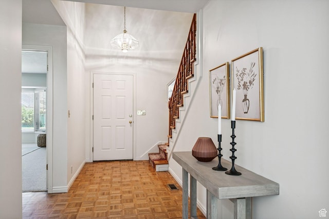 2056 E Sierra View Cir, Millcreek, UT 84109 - entryway with stairway and a chandelier